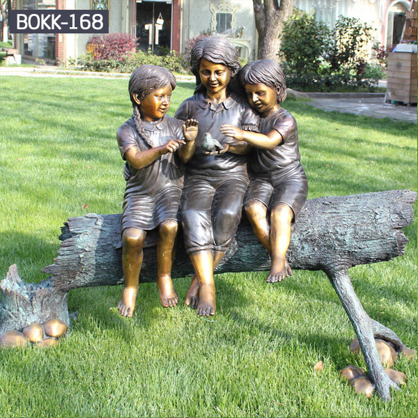Outdoor public lawn decor three children sitting on the trunks play sculpture