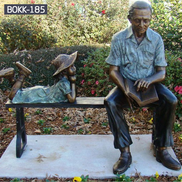 Grandpa is reading books on the benches for his little granddaughter bronze sculptures