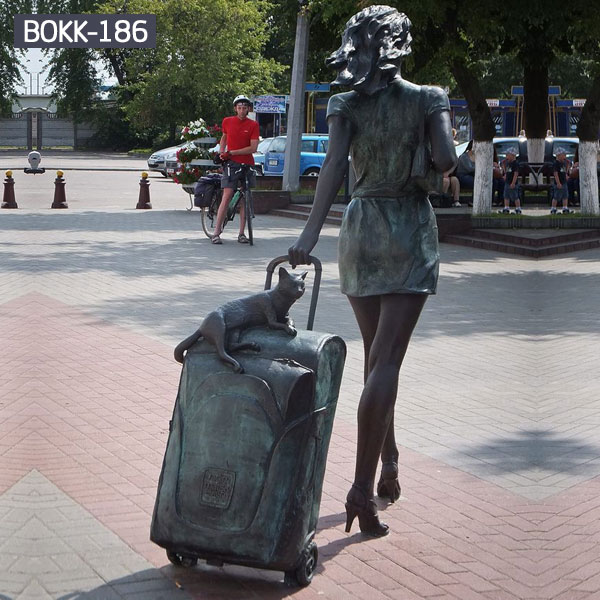 Modern city girl with suitcase and cat life size bronze sculptures