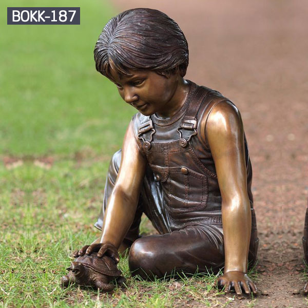 Bronze life size playing boy sitting on the lawn sculptures