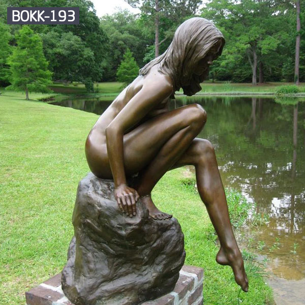 Life size nude woman bronze sculptures in the side of river outdoor
