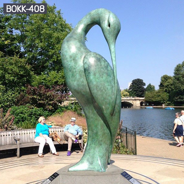 Large blue bronze casting swan sculpture in the center of the lawn